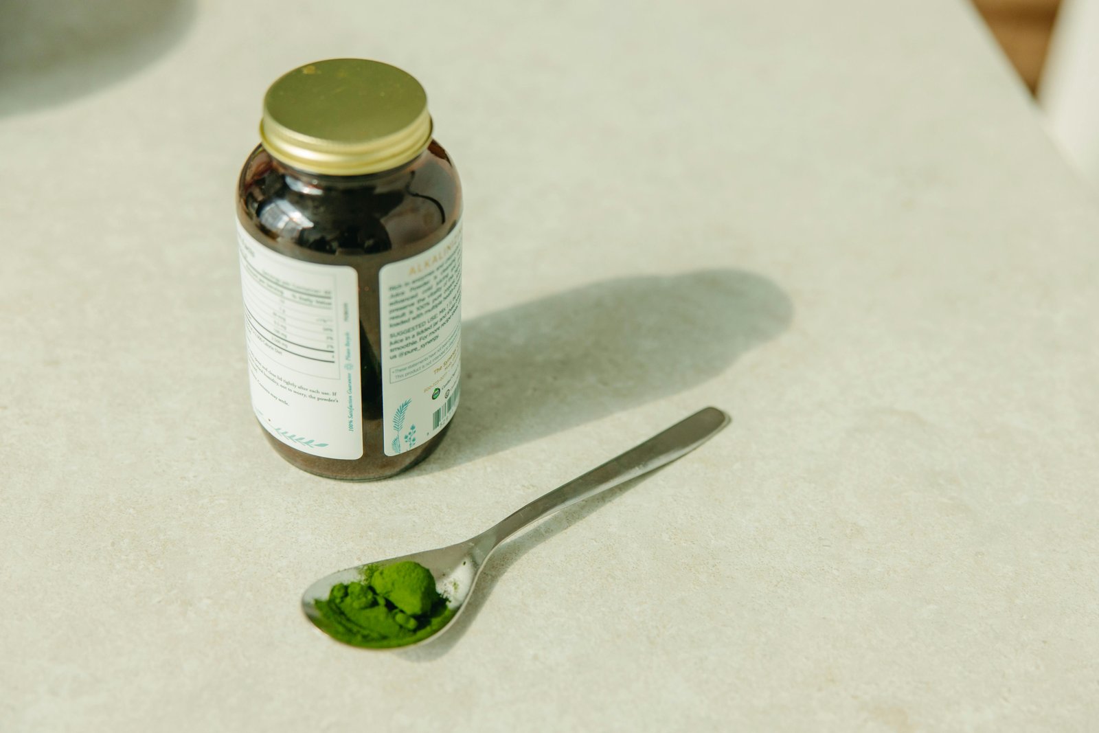 Green botanical powder and supplement jar